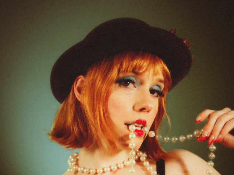 Madelline Emerges with a Cheeky Pop Anthem on Overthinking with “Happy as Hell”